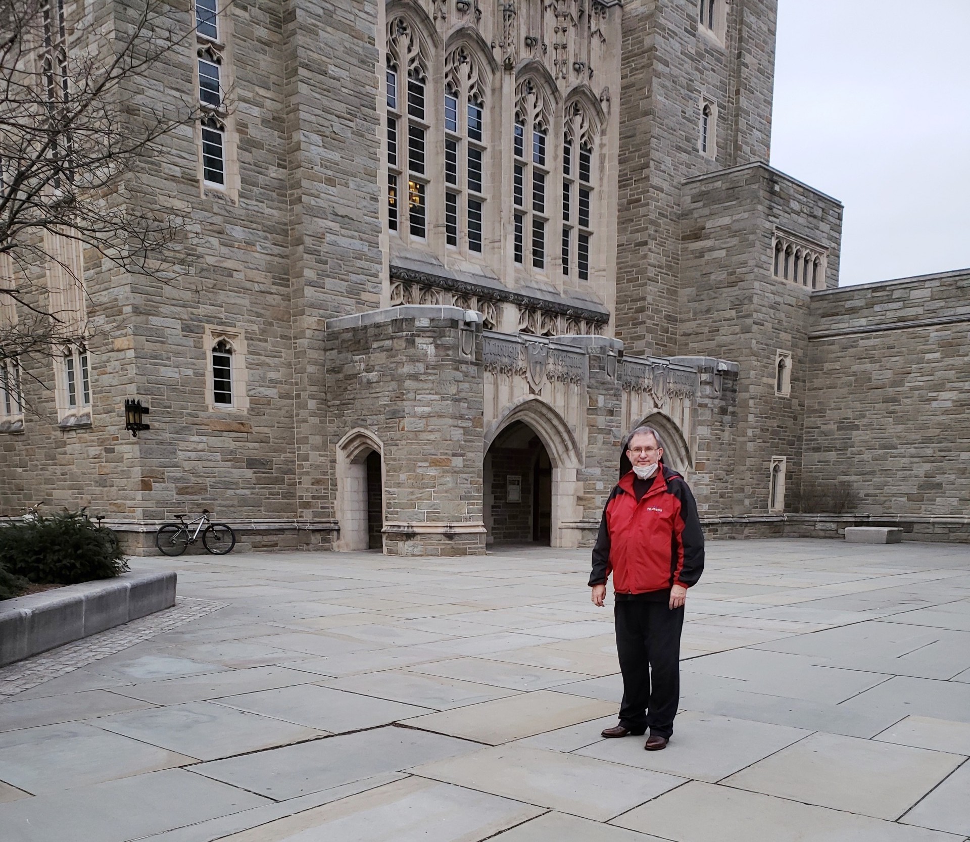 Prof. Seger standing in front of the neo-Gothic architectural style Harvey Firestone Research Library at Princeton University.