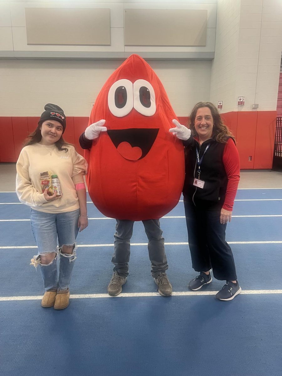 Staff writer Yanci Castro with representatives of the SCCC blood drive.